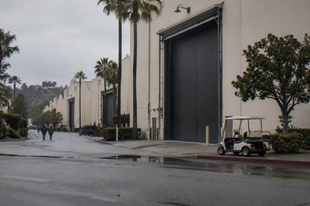 Historic soundstage facade with tall stage doors and stage number painted on the wall