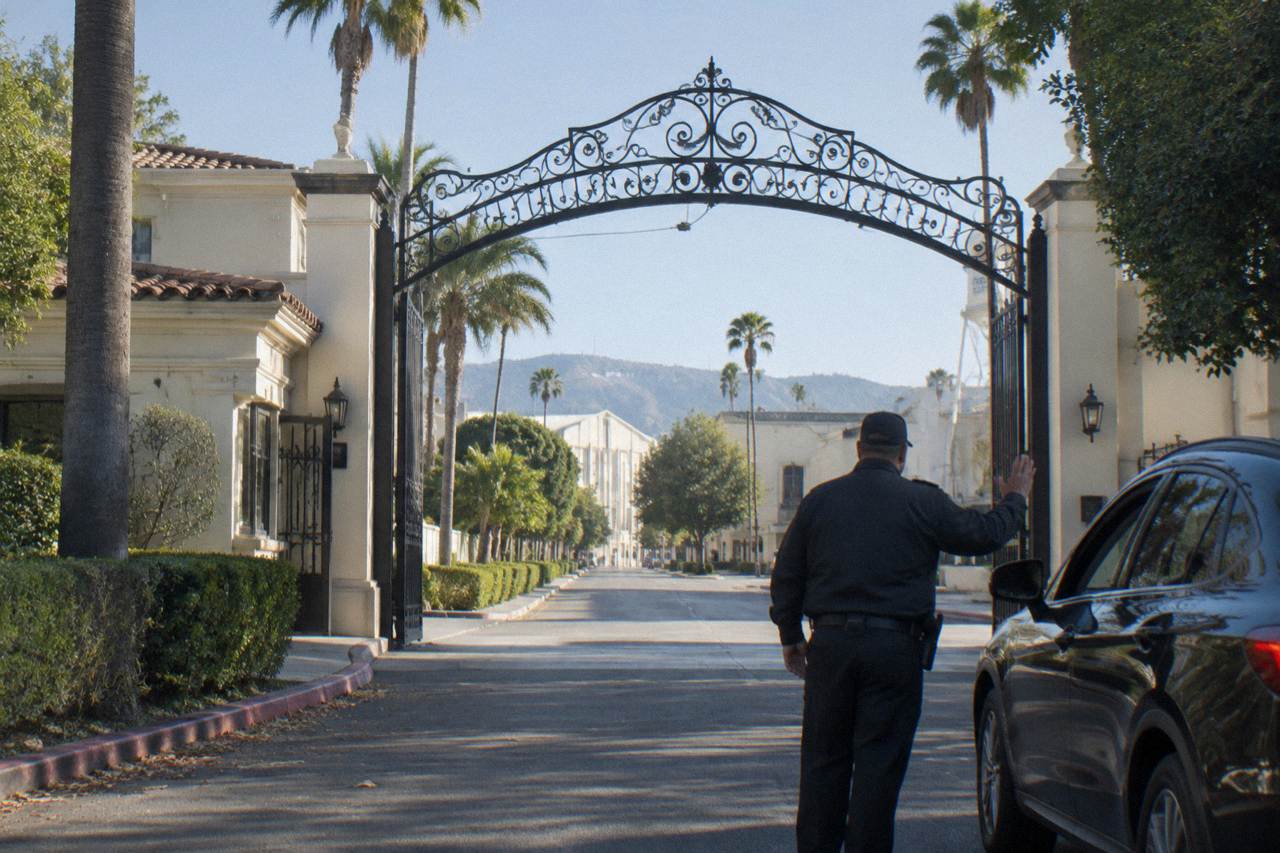 The Bronson Gate archway at the Paramount Pictures studio lot in Hollywood under a clear sky