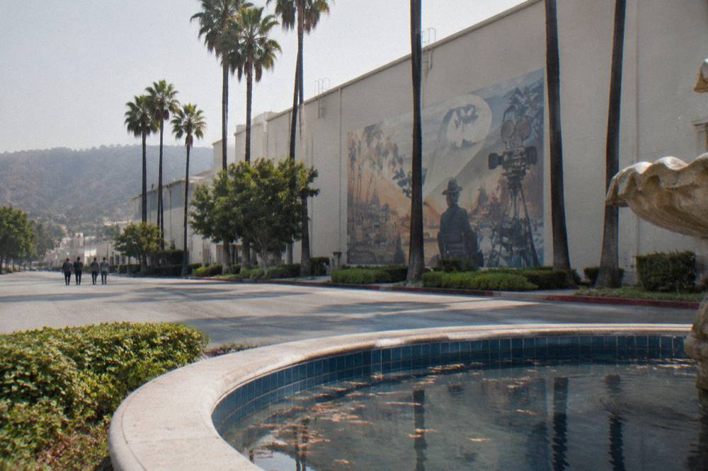 The Warner Bros. Stage 48 building exterior with a large Friends logo and a fountain in the foreground
