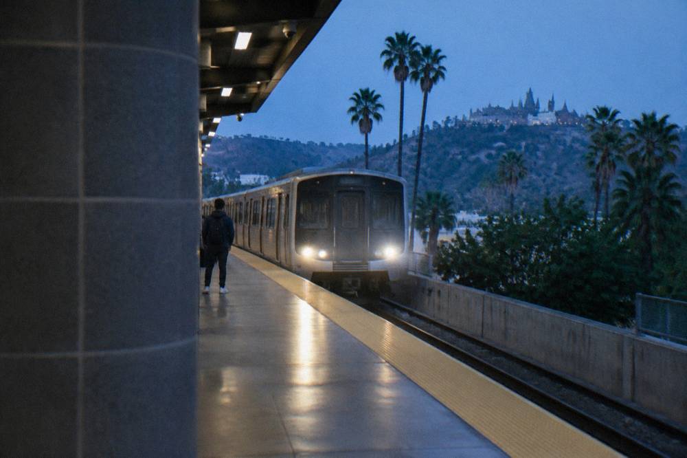 Subway platform with a train arriving at a Los Angeles Metro station