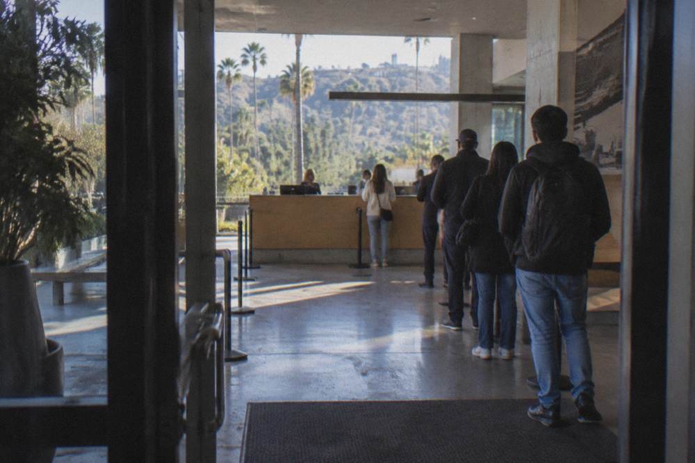 A security gate and check-in desk at a studio tour entrance