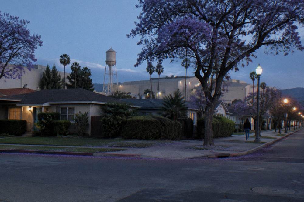A quiet Culver City street corner near a studio entrance gate