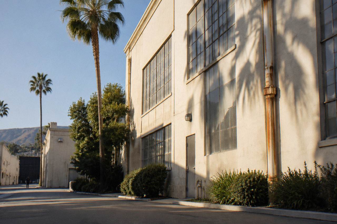 A historic Culver City soundstage facade under a clear Southern California sky